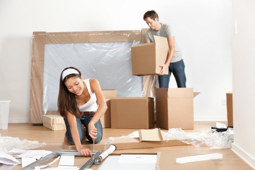 Removal van team sorting recyclable moving materials in Sutton