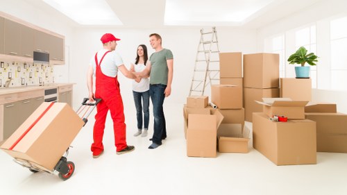 Local team collecting old sofas and tables from a Sutton home