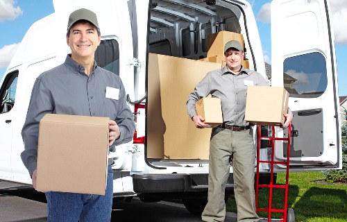 Local Sutton packing team handling fragile household items